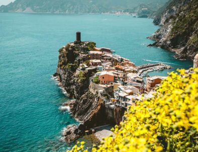 cinque terre coast - small village - yellow flowers - destinatuions by Timeless Tuscany tour operator